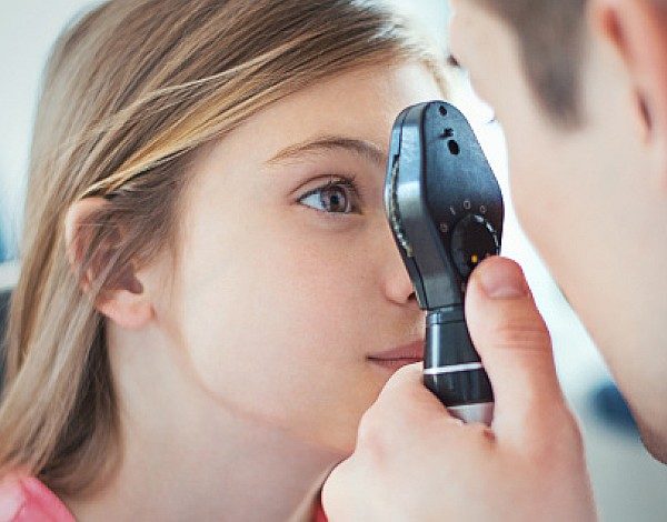 Picture of Docor Examining Girl's Eye